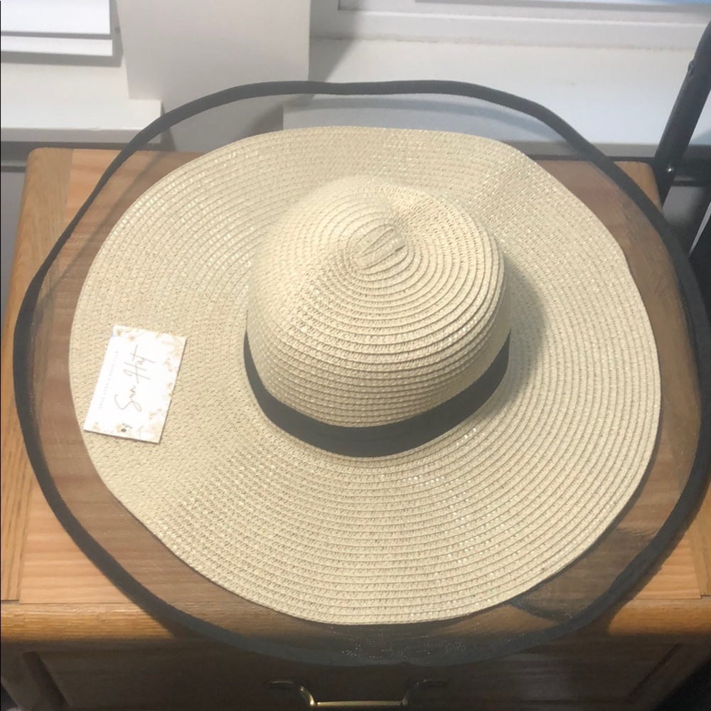 Elegant Wide-Brimmed Straw Hat with Black Ribbon